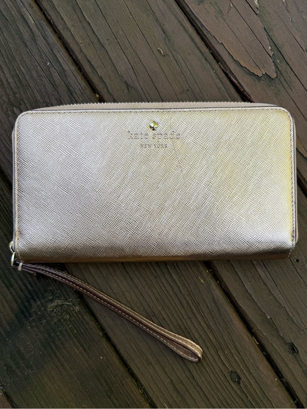 Kate Spade gold wristlet wallet